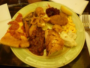 Kerianne's buffet fun!!! See if you can spot all of these foods in the image above: Pizza, Rotisserie Chicken, Barbecue Beans, Macaroni and Cheese, Mashed Potatoes, Hush puppies, Lemon, Catfish, Cranberry Sauce, Crab Wonton, Black-eyed peas, Steak Fries...I think that's all of them...